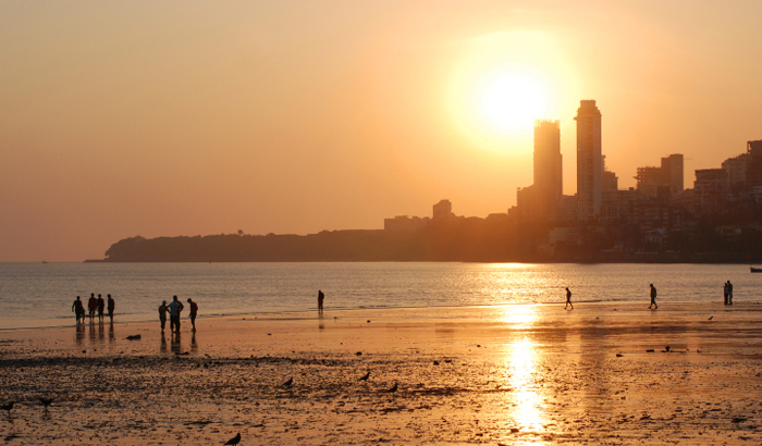 Chowpatty Beach, a popular attraction near a sea view hotel on Marine Drive, Mumbai, offering a vibrant beachfront atmosphere and stunning ocean views