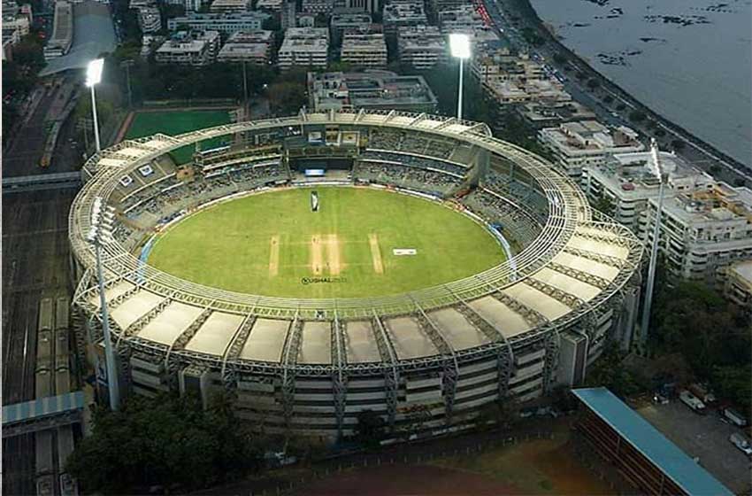 Wankhede Stadium, a renowned cricket venue near sea-facing hotels in Mumbai, hosting thrilling matches against the backdrop of the sea
